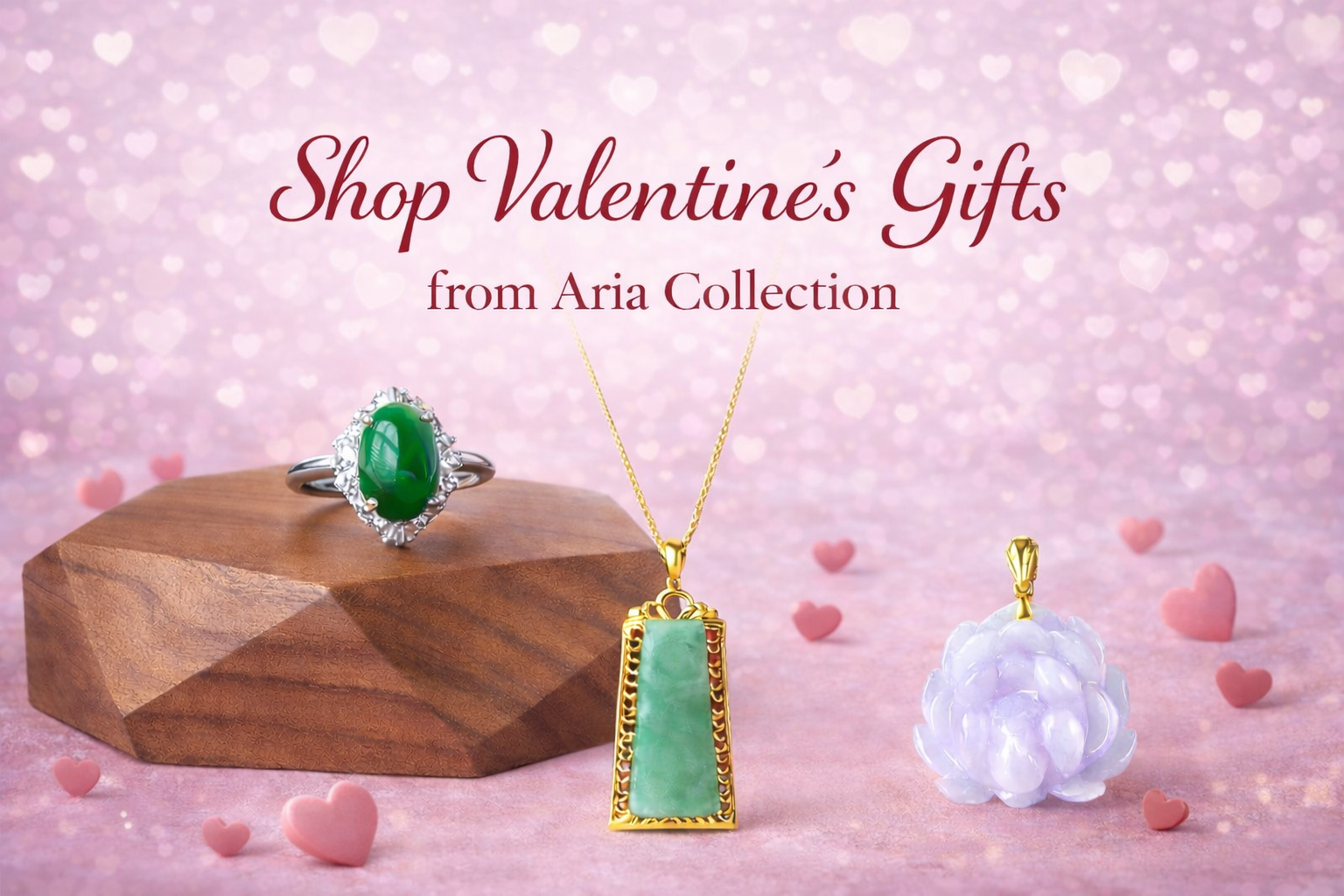 Jewelry including a ring, necklace, and pendant on a pink background with 'Aria Collection' text.