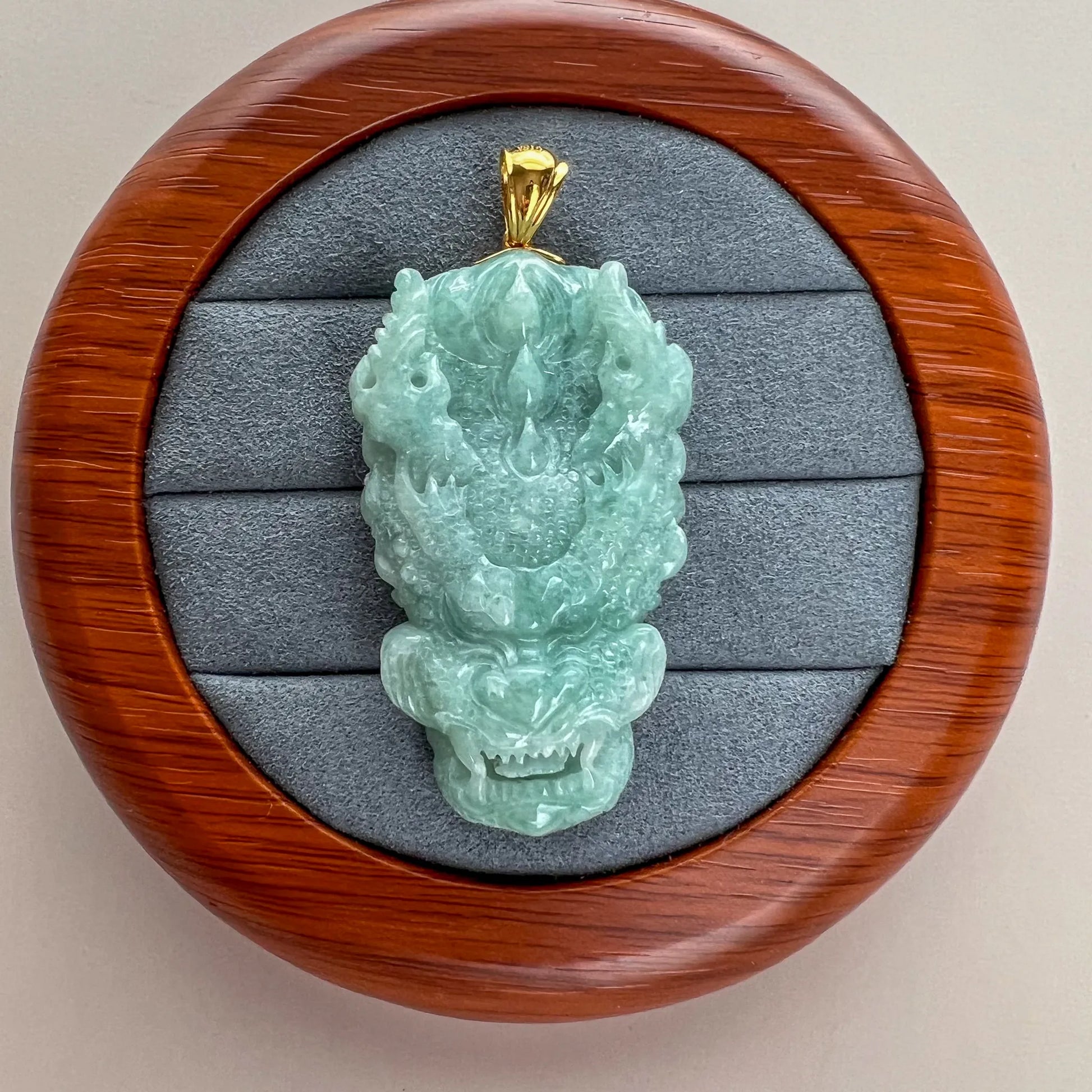 Aria Design Collection light green natural jade dragon pendant with deep carving and polished finish