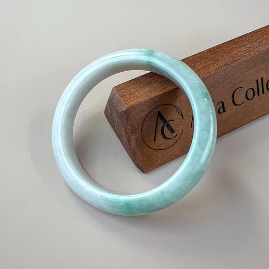 Aria Collection plain round Natural Jade bangle in light green with glossy polished finish