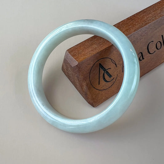 Aria Collection smooth light blue Natural Jade bangle with glossy polished rounded finish