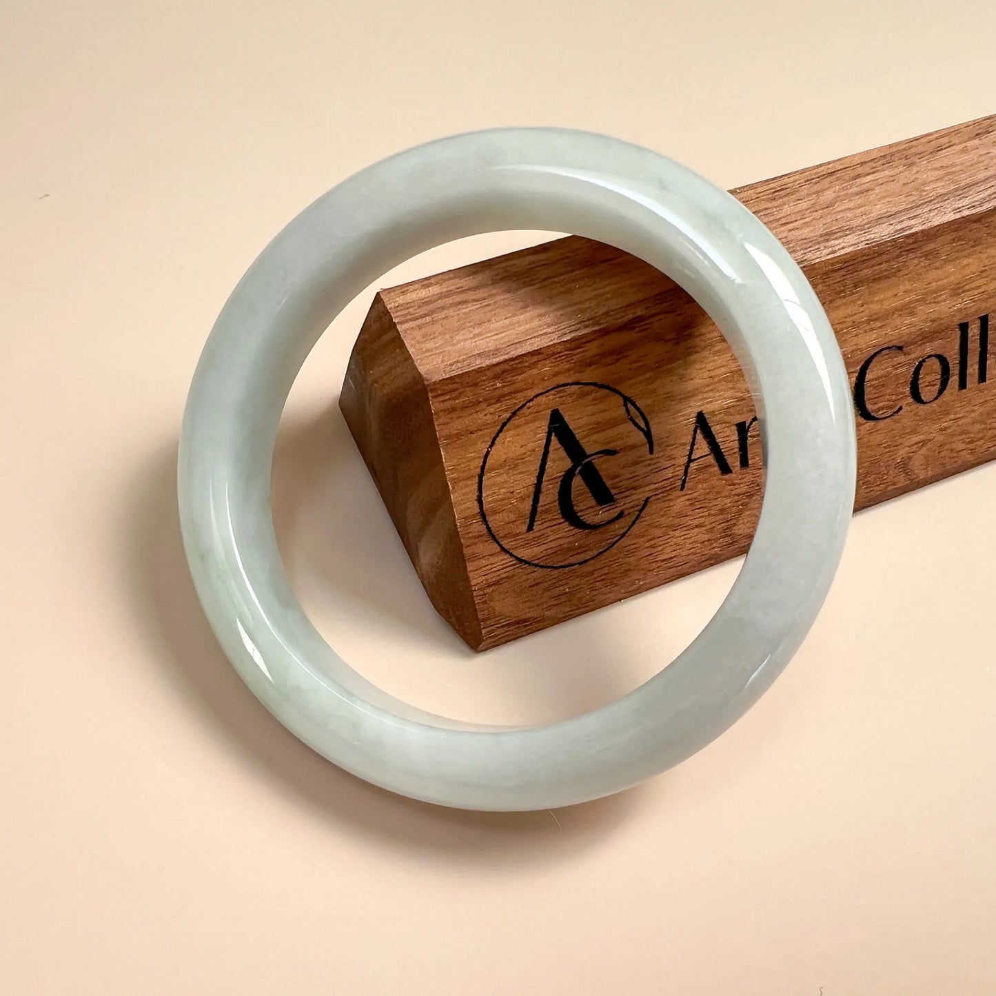 Aria Design Collection smooth light green-blue jadeite bangle with rounded profile and glossy finish