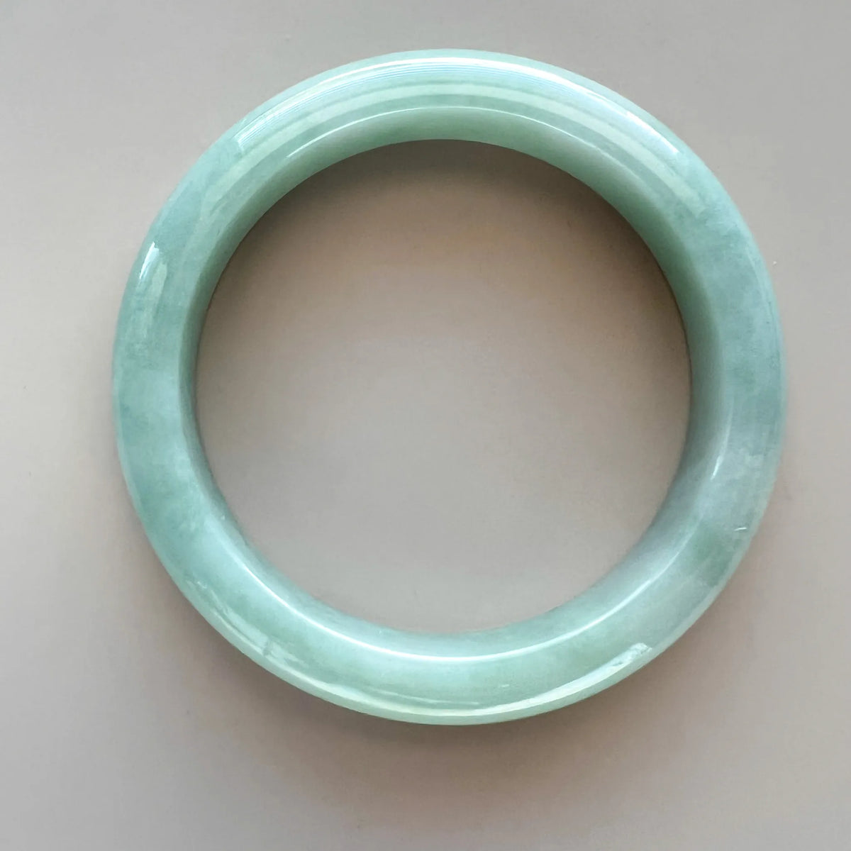 Aria Design Collection light green-blue jadeite bangle with carved grooves and a polished finish