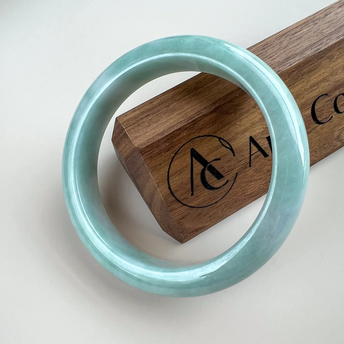 Aria Design Collection light green-blue jadeite bangle with a smooth rounded profile and polished finish