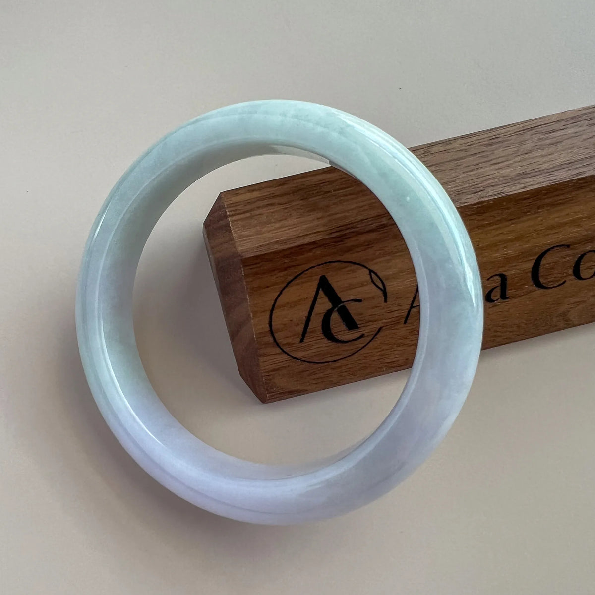 Aria Design Collection pale blue-green jadeite bangle with a smooth rounded profile and high-polish finish