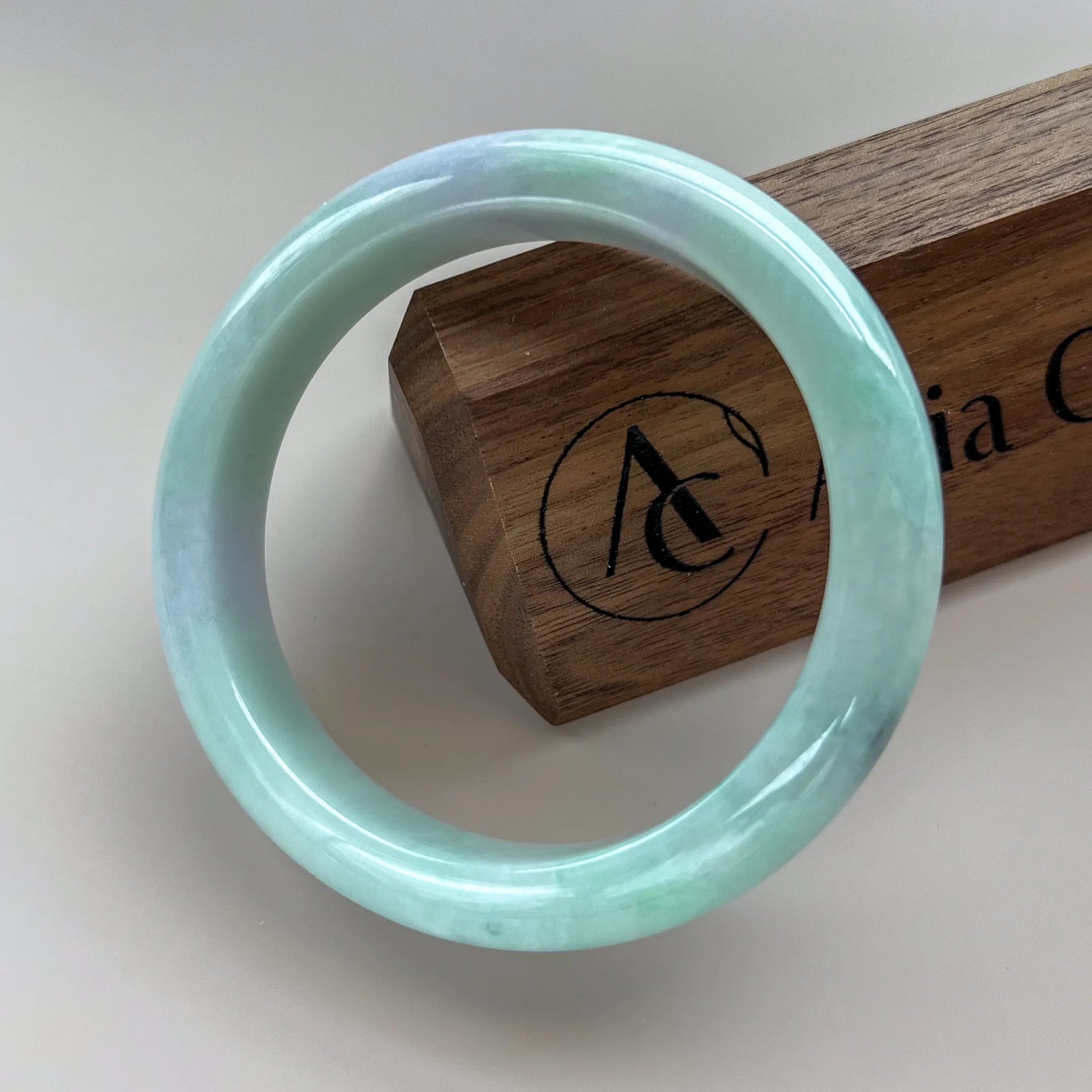 Aria Design Collection light green-blue jadeite bangle with a classic rounded profile and polished finish