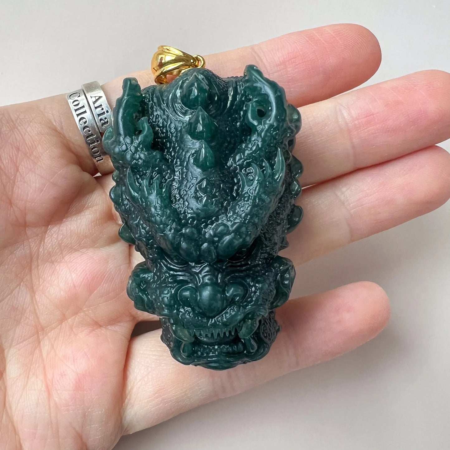 Aria Collection dark green Natural Jade dragon head pendant with glossy carved finish