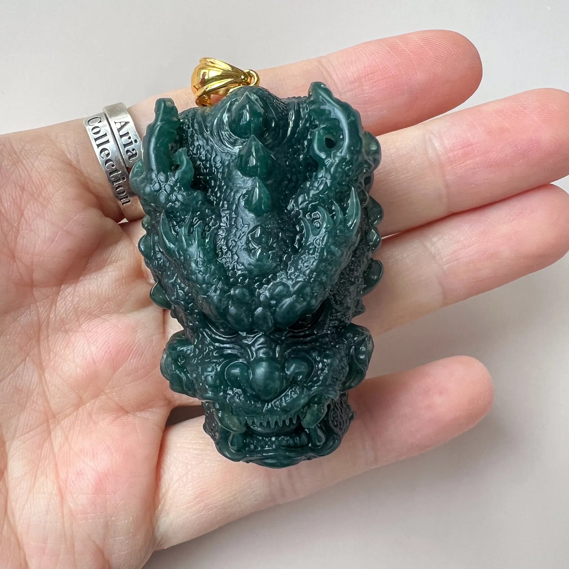 Aria Collection dark green Natural Jade dragon head pendant with glossy carved finish