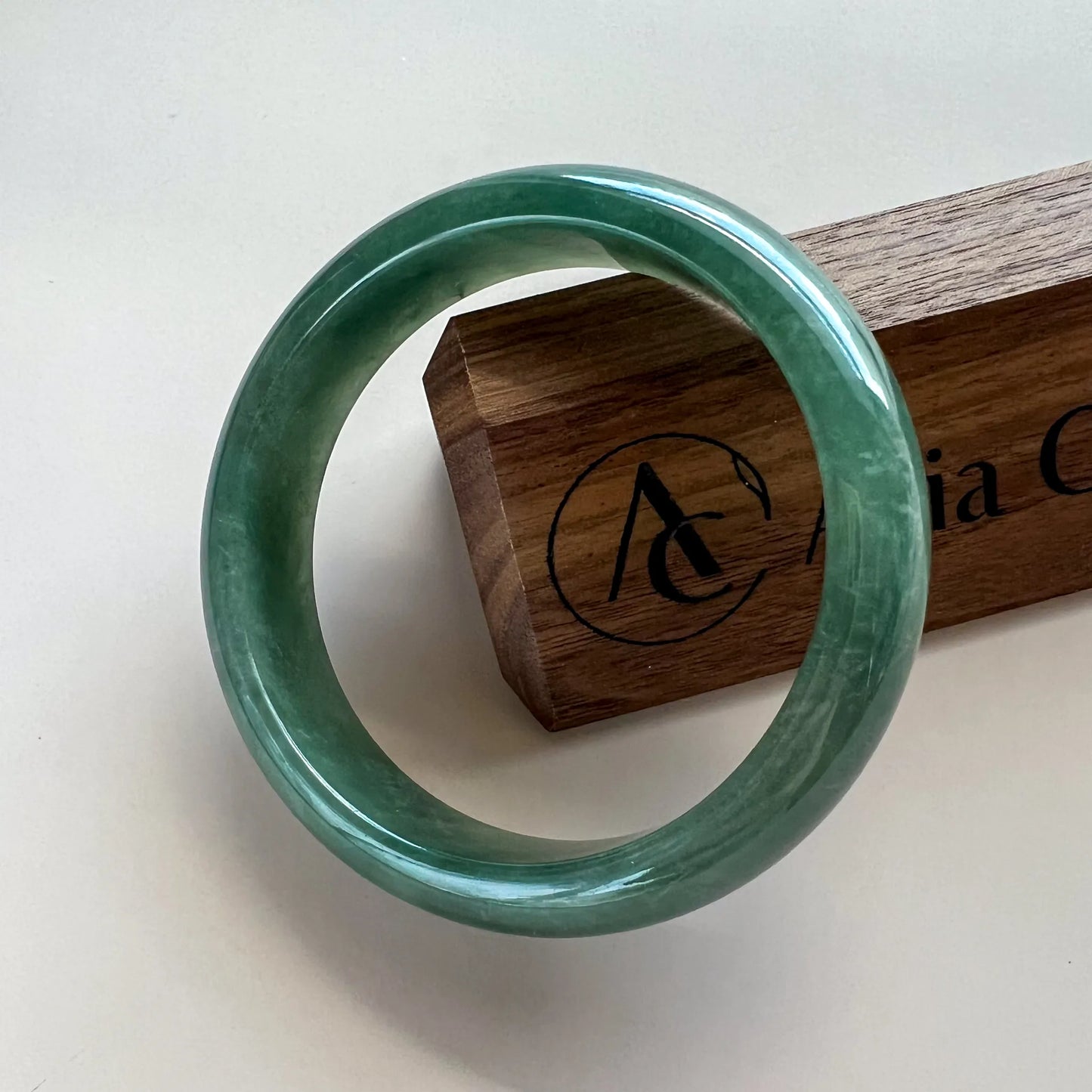 Aria Design Collection dark green jadeite bangle with an uncarved rounded profile and high-polish finish