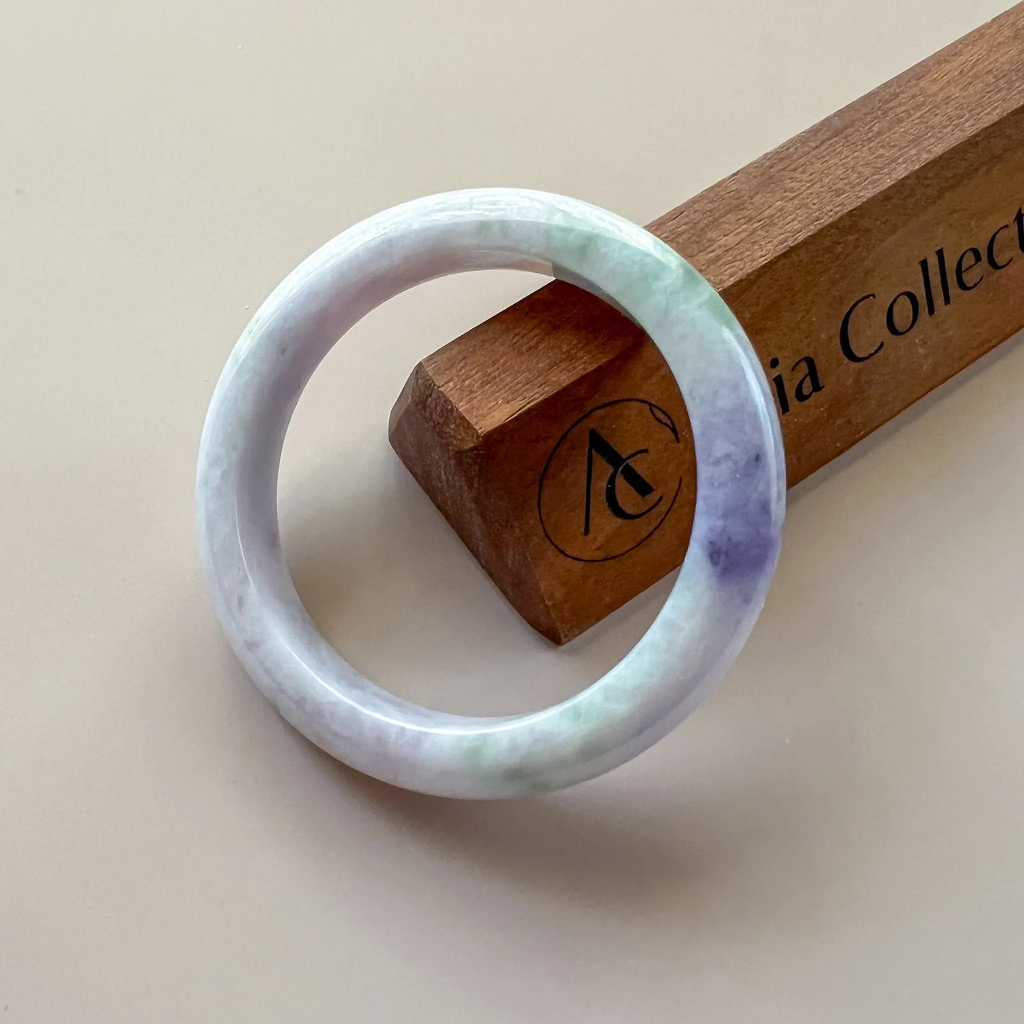 Aria Design Collection uncarved lavender-green jadeite bangle with a polished rounded finish