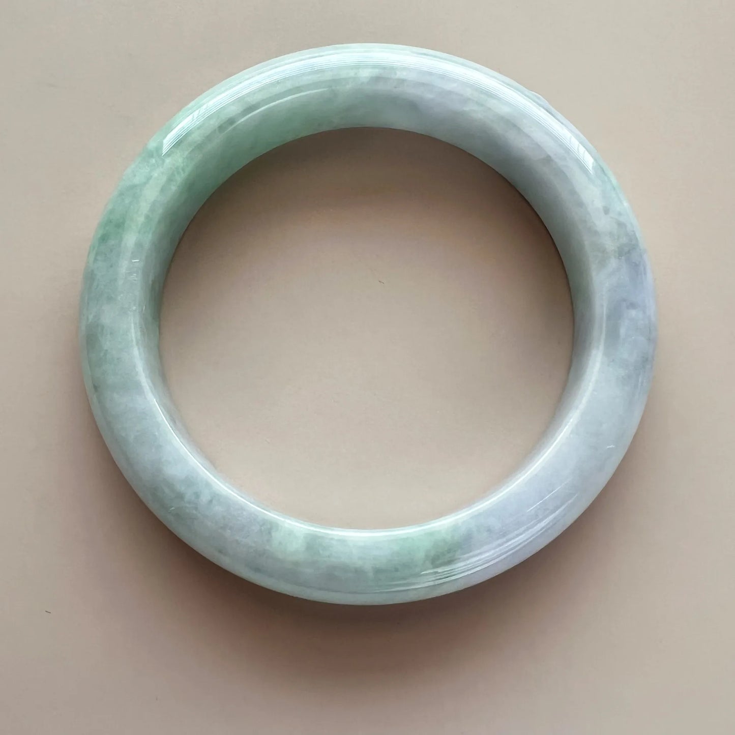 Aria Design Collection light green jadeite bangle with a smooth rounded form and high-polish finish