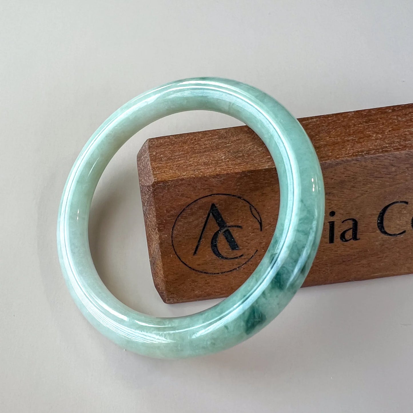 Aria Design Collection light green jadeite bangle with a classic rounded profile and glossy polished finish