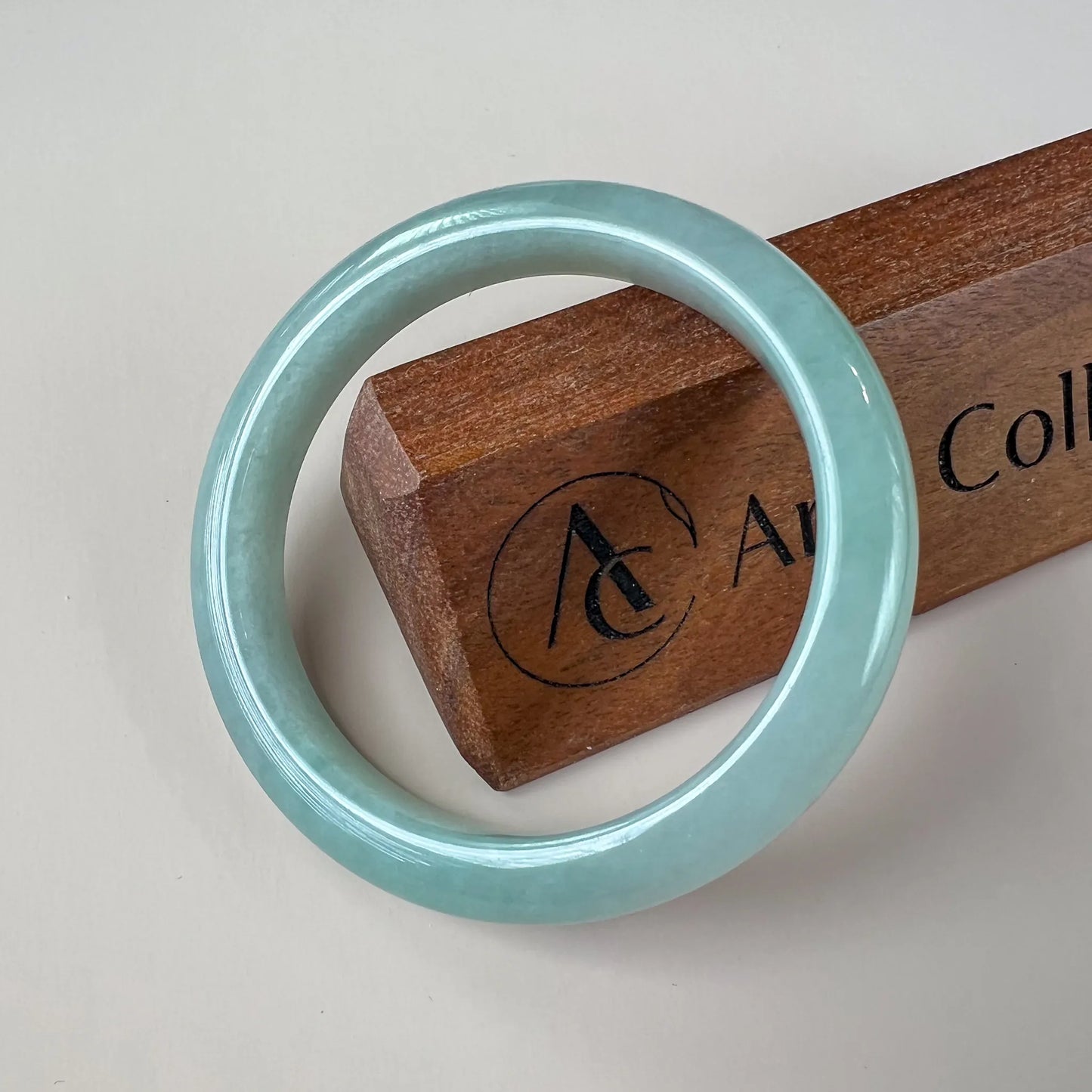 Aria Design Collection light green-blue jadeite bangle with a plain rounded profile and polished finish