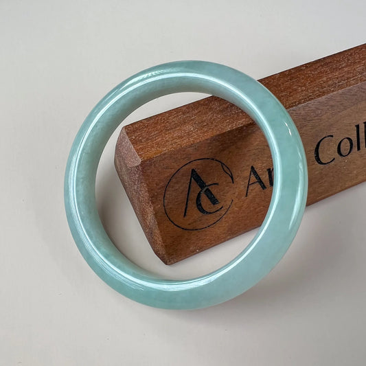 Aria Design Collection light green-blue jadeite bangle with a plain rounded profile and polished finish