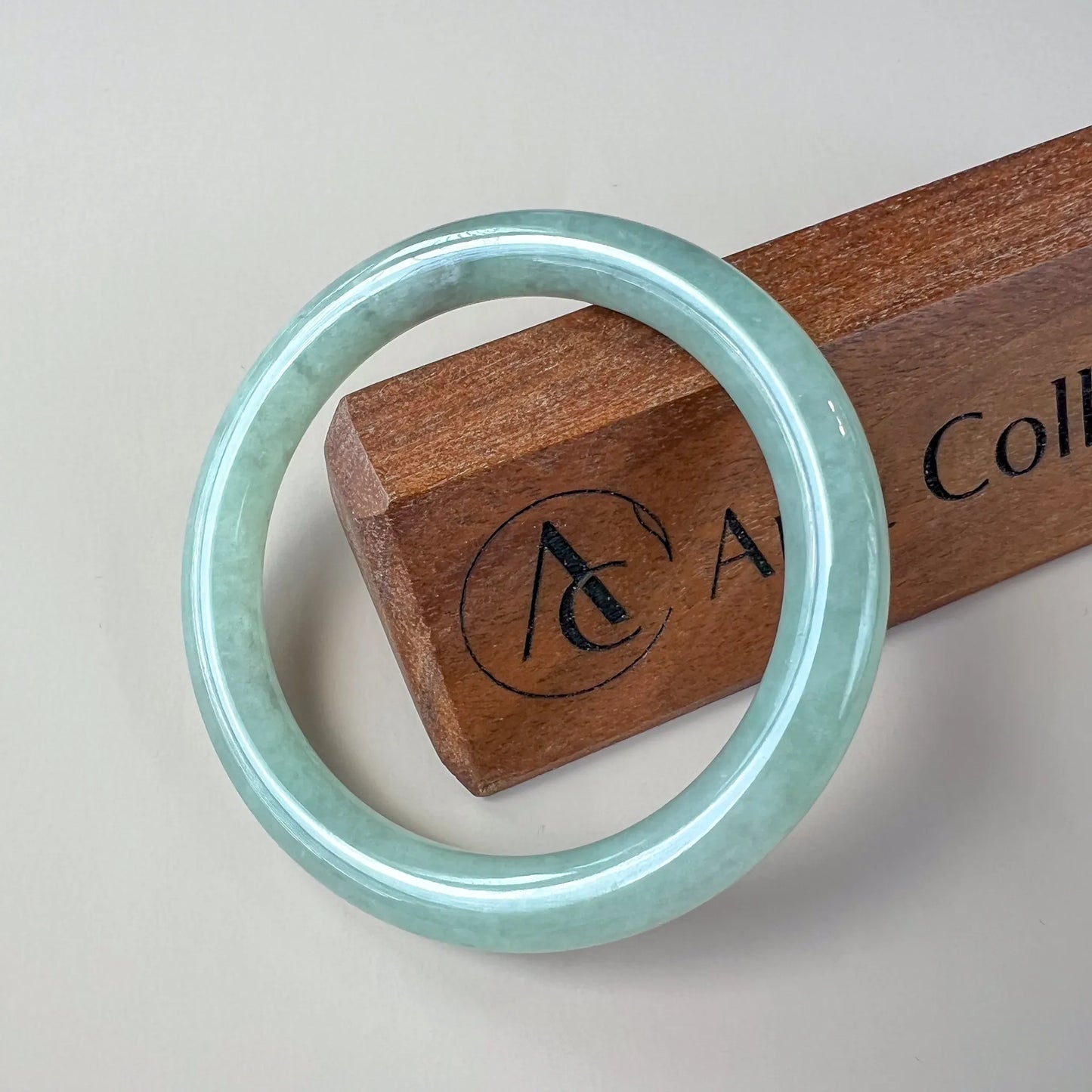 Aria Design Collection classic uncarved green-blue jadeite bangle with a smooth polished finish