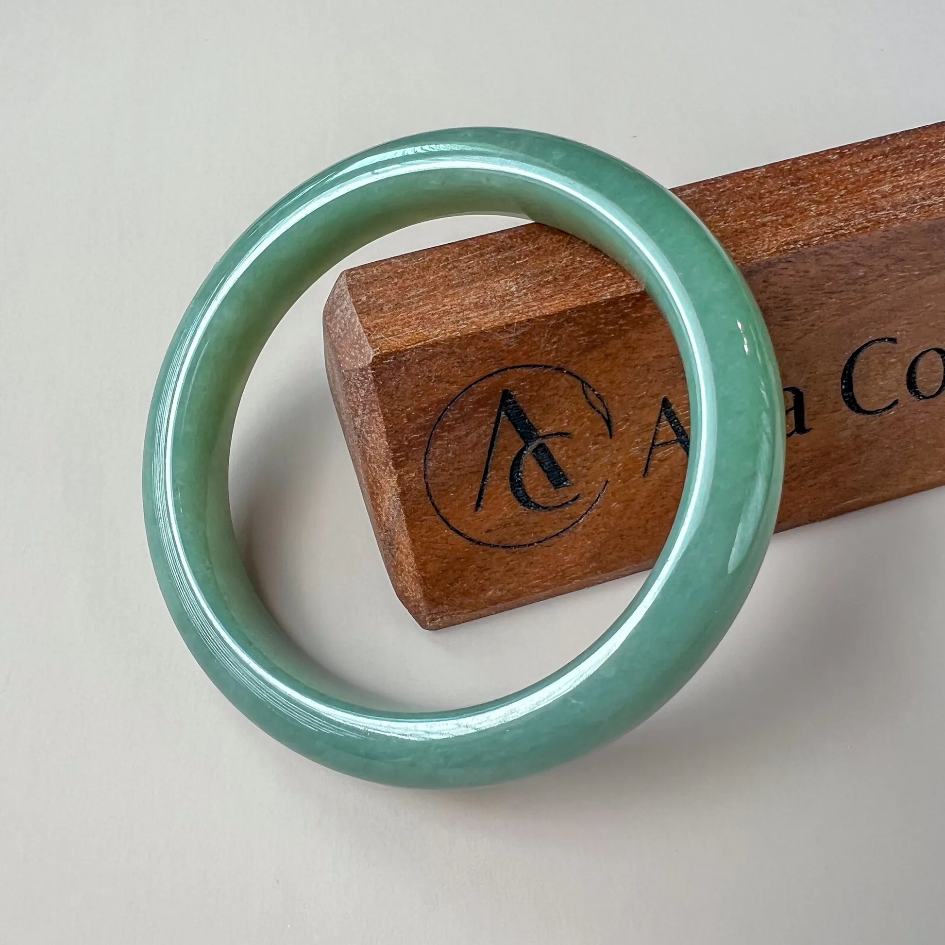 Aria Design Collection light green-blue jadeite bangle with a plain rounded profile and polished finish