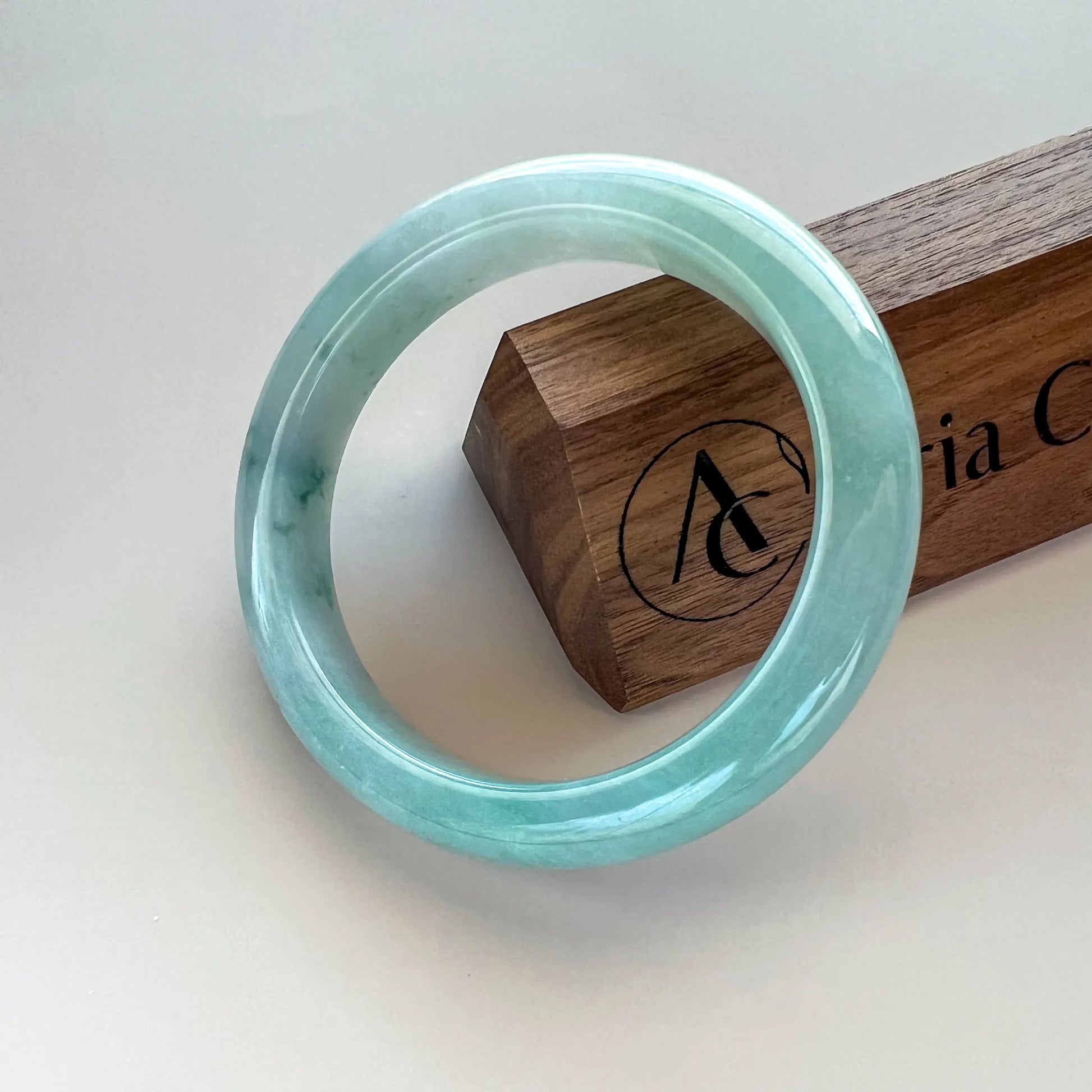 Aria Design Collection uncarved blue-green jadeite bangle with a smooth, high-polish finish