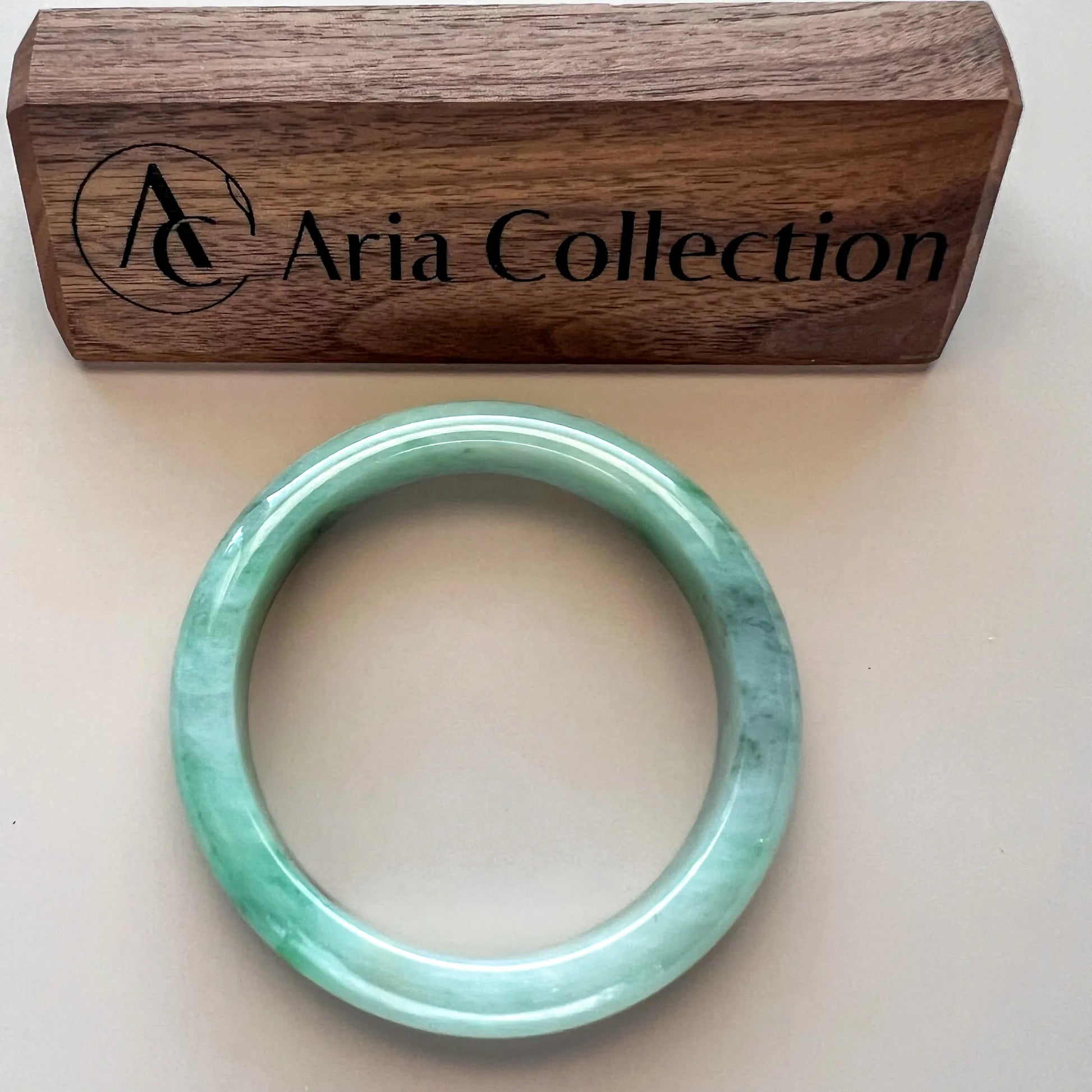 Aria Design Collection light green jadeite bangle with an uncarved rounded profile and polished finish