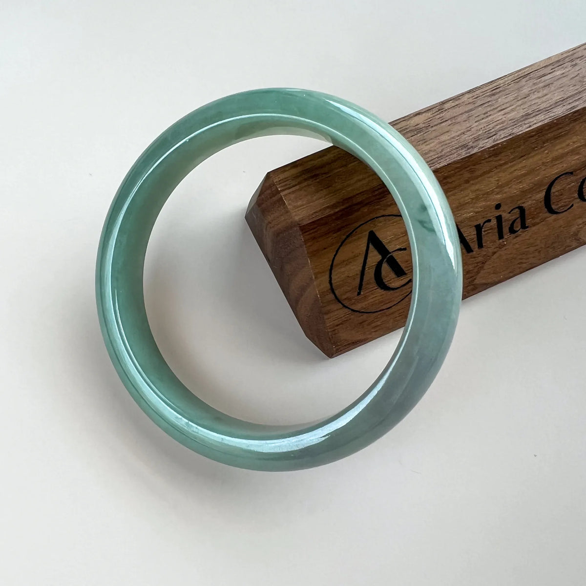Aria Design Collection light green-blue jadeite bangle in a classic uncarved form with a glossy polished finish