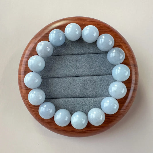 Aria Design Collection light blue natural jade round bead bracelet with a polished finish