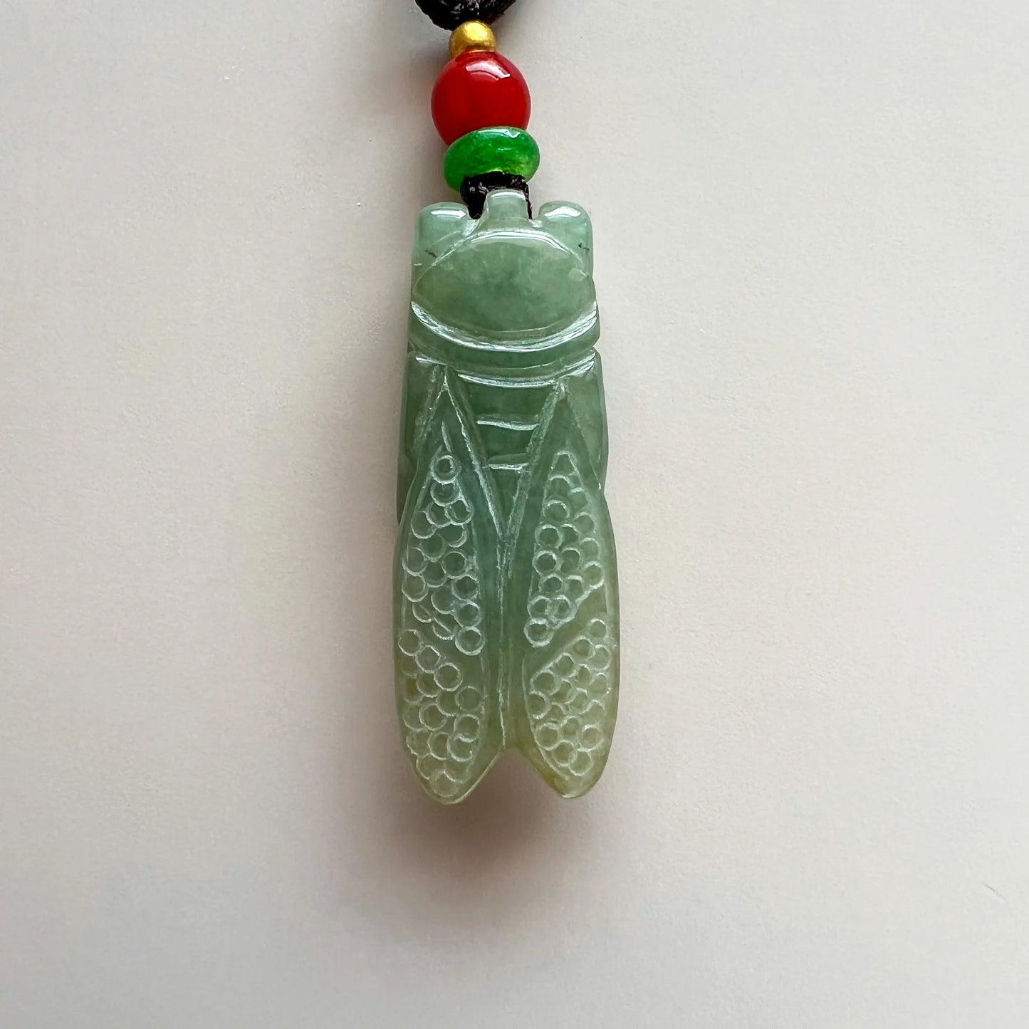 Aria Design Collection light green natural jade cicada pendant with polished carved wings