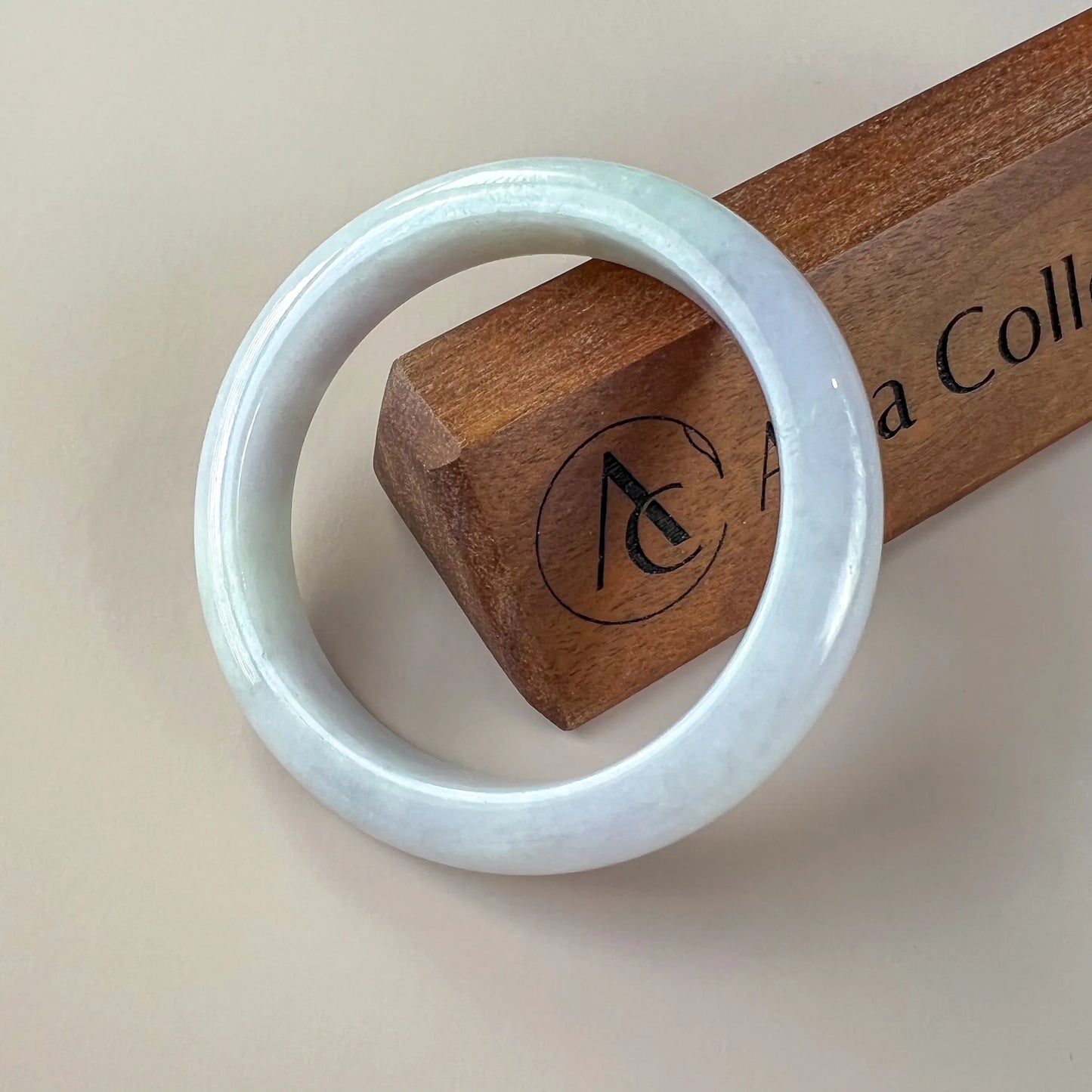 Aria Collection smooth icy white natural jade bangle with rounded profile and glossy polished finish