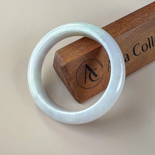 Aria Collection smooth icy white natural jade bangle with rounded profile and glossy polished finish