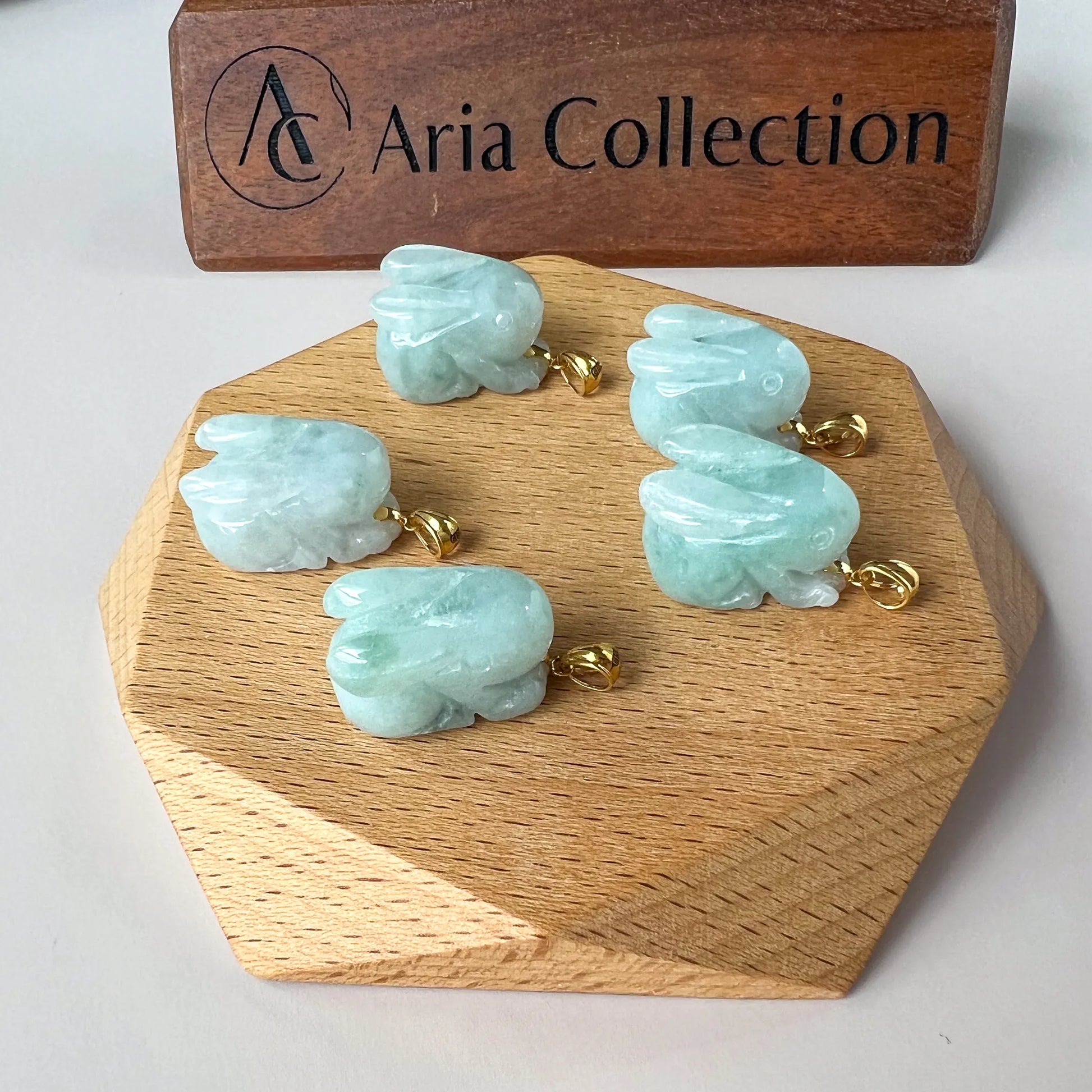 Aria Collection carved rabbit Natural Jade pendant in pale aqua green with glossy polished finish