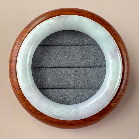 Aria Collection polished natural jade bangle in pale green and white with smooth rounded finish