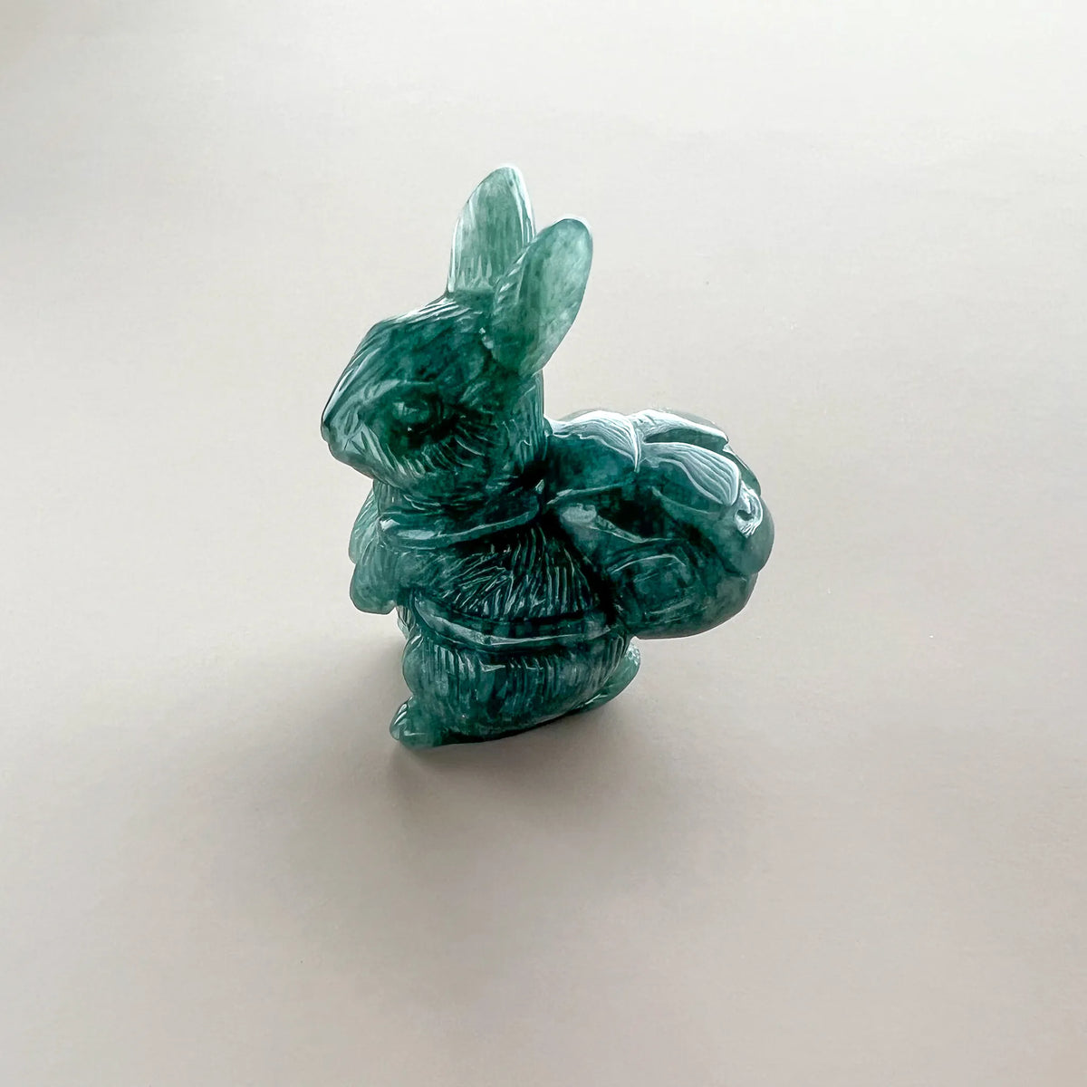 Aria Design Collection green natural jade rabbit with basket carving and polished finish