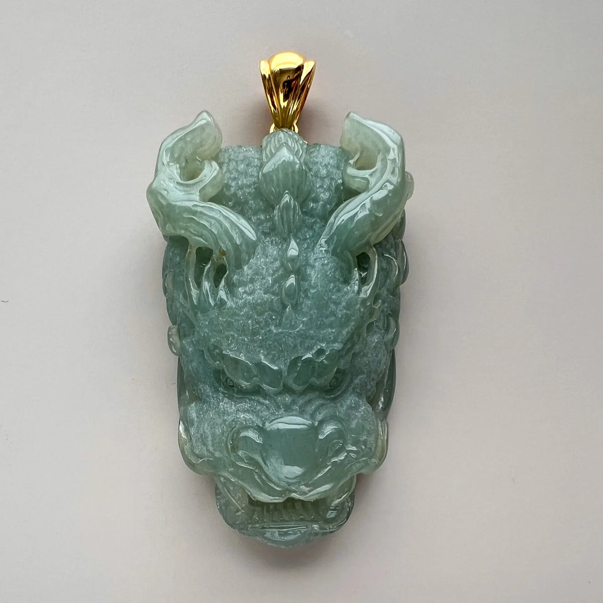 Aria Design Collection light green Natural Jade dragon ball pendant with polished carved finish