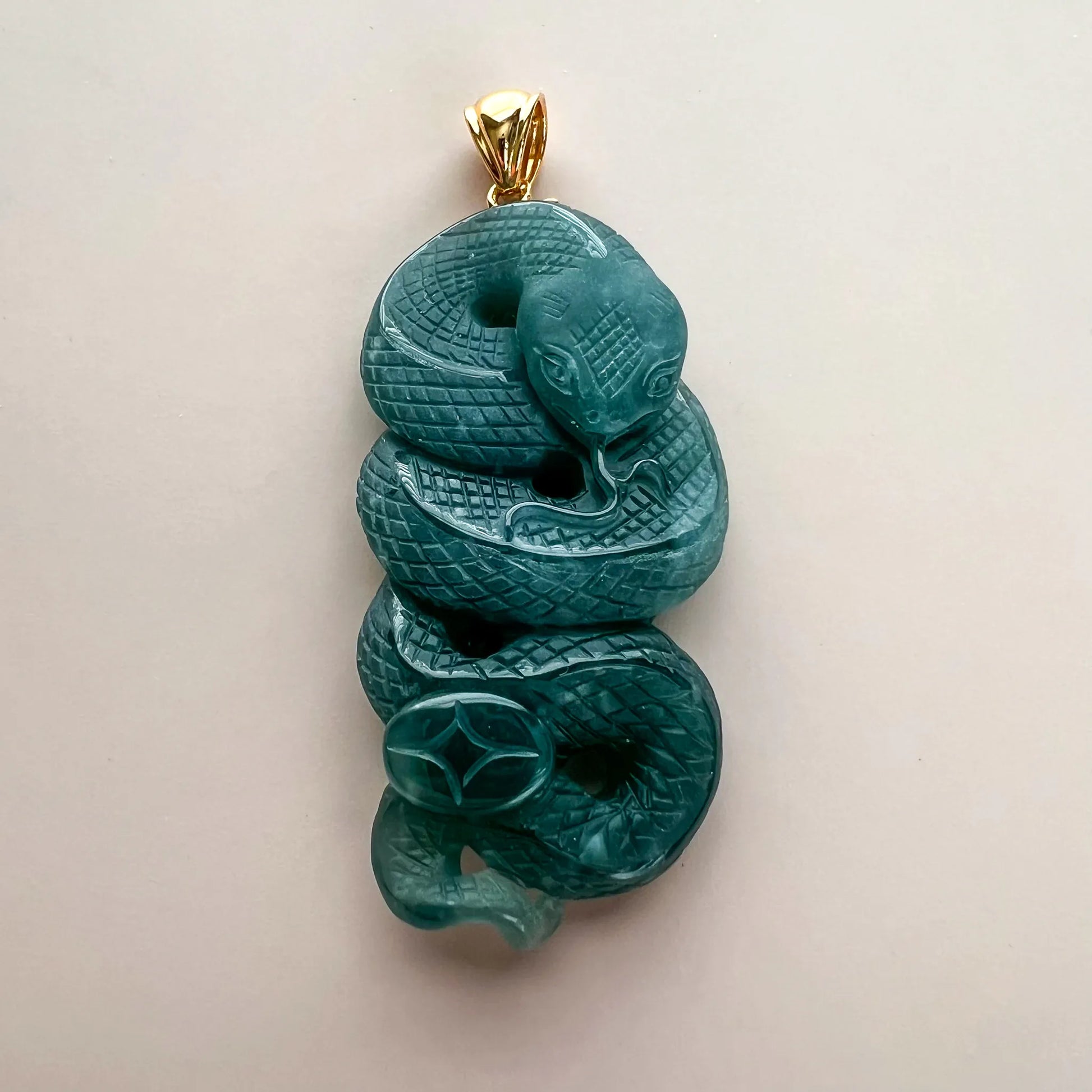 Aria Design Collection teal-green Natural Jade snake pendant with detailed relief carving and polished finish