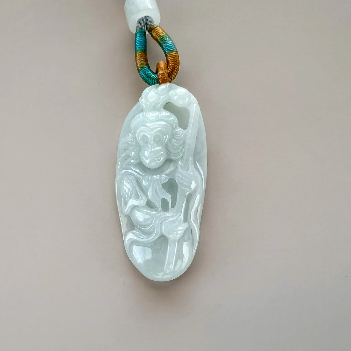 Aria Design Collection Monkey King natural jade pendant with detailed carving and glossy polished finish