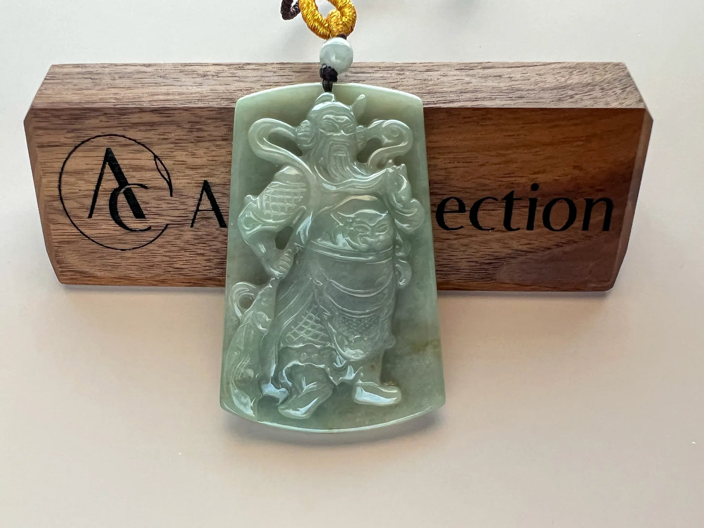 Aria Design Collection natural jade Guan Gong pendant with detailed relief carving and polished light green finish