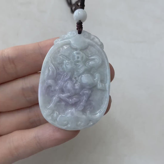 Video of natural purple and green jadeite horse pendant with coin and Ruyi details, carved in a unique style