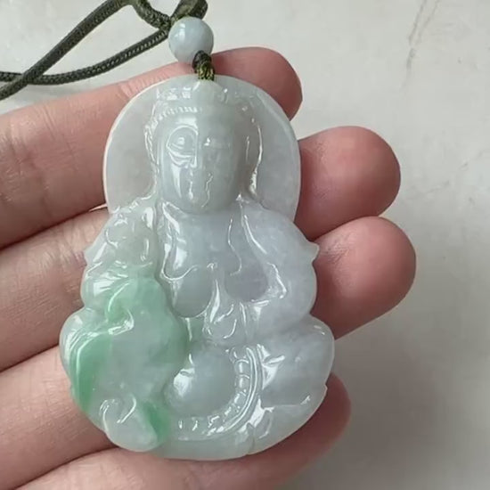 Video of a hand-carved green jade Guan Yin pendant with serene Buddhist talisman style and elegant detailing