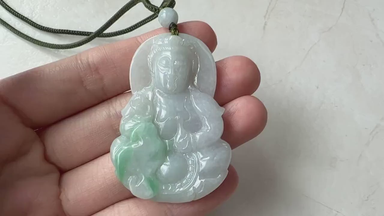 Video of a hand-carved green jade Guan Yin pendant with serene Buddhist talisman style and elegant detailing