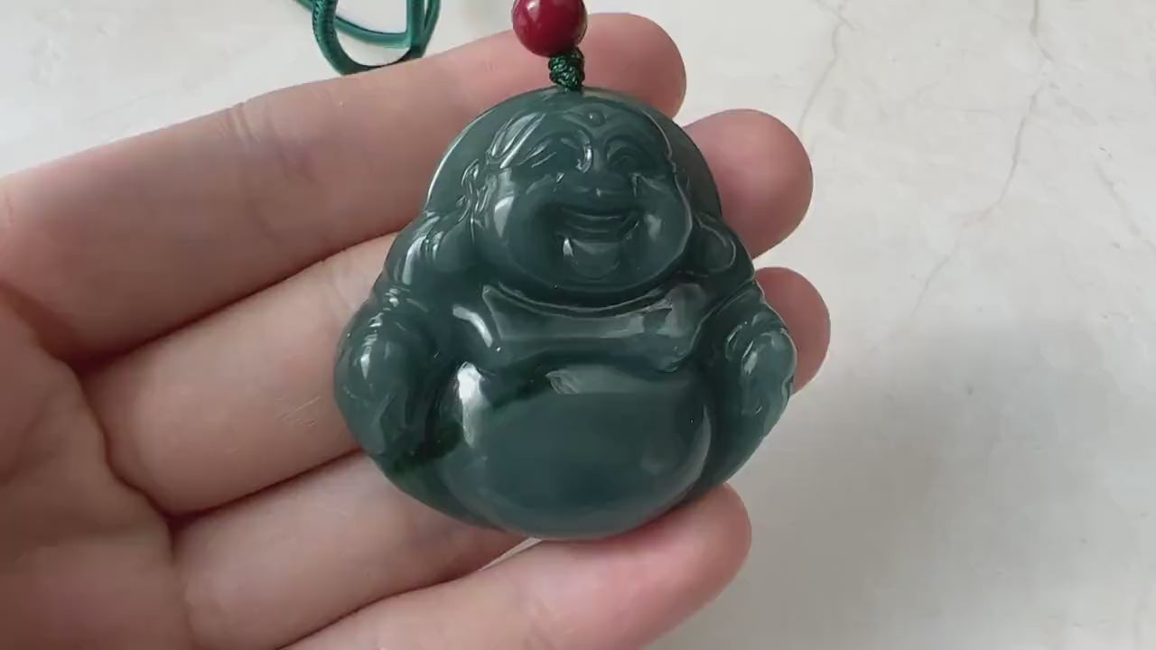 Video of a carved jade Laughing Buddha pendant in blue-green with a bright green streak and soft translucent glow