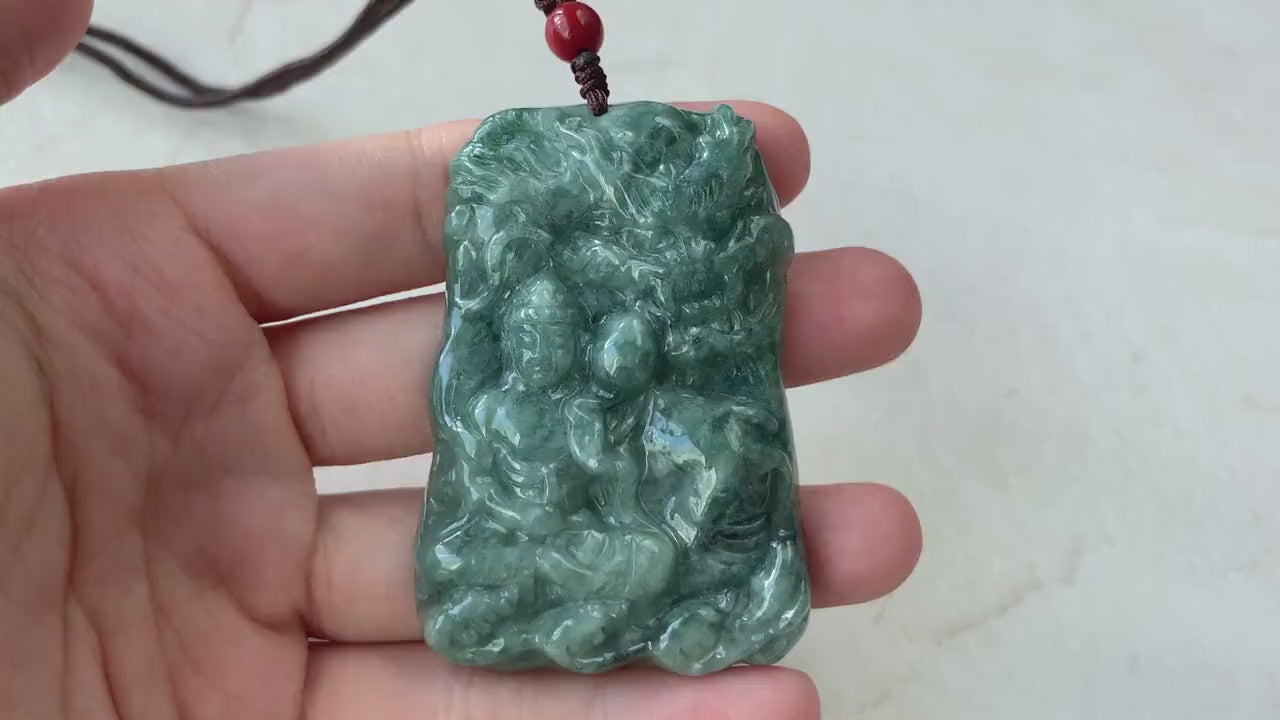 Video of hand-carved jade pendant with Amitabha Buddha and dragon, intricate serene green carving