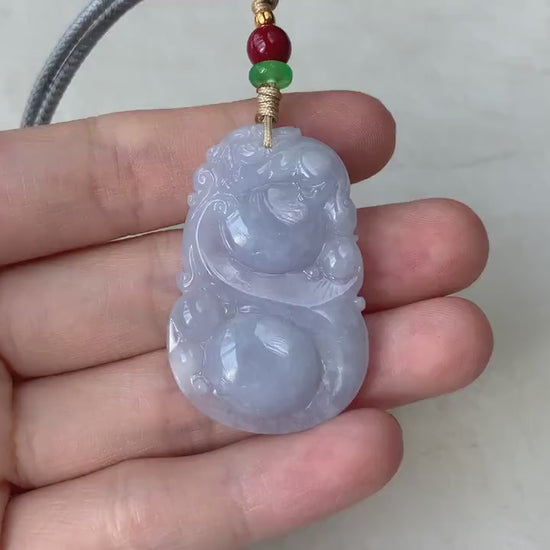Video of a hand-carved green jade pendant with Ruyi and calabash design, elegant and auspicious.