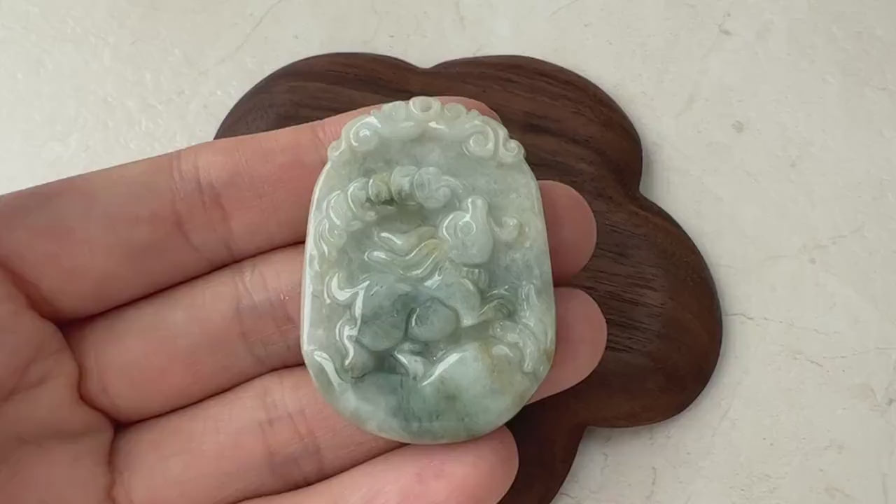 Video of hand-carved natural jadeite rabbit pendant in green jade, with Chinese coins and daikon radish detail