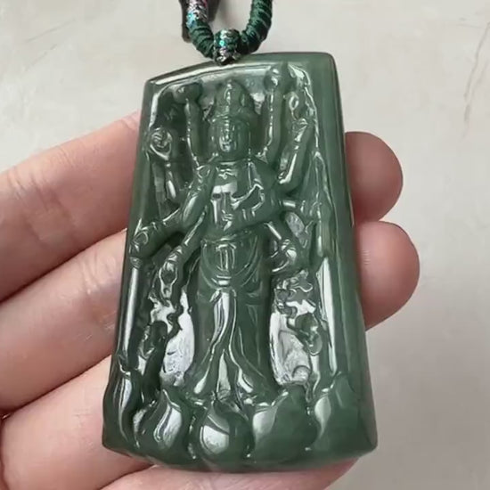 Video of a hand-carved green jadeite Guan Yin pendant with a thousand-hand design and soft natural glow