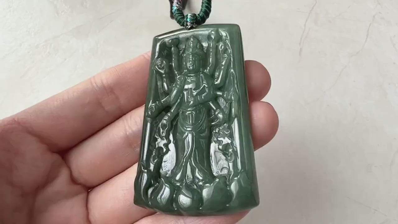 Video of a hand-carved green jadeite Guan Yin pendant with a thousand-hand design and soft natural glow