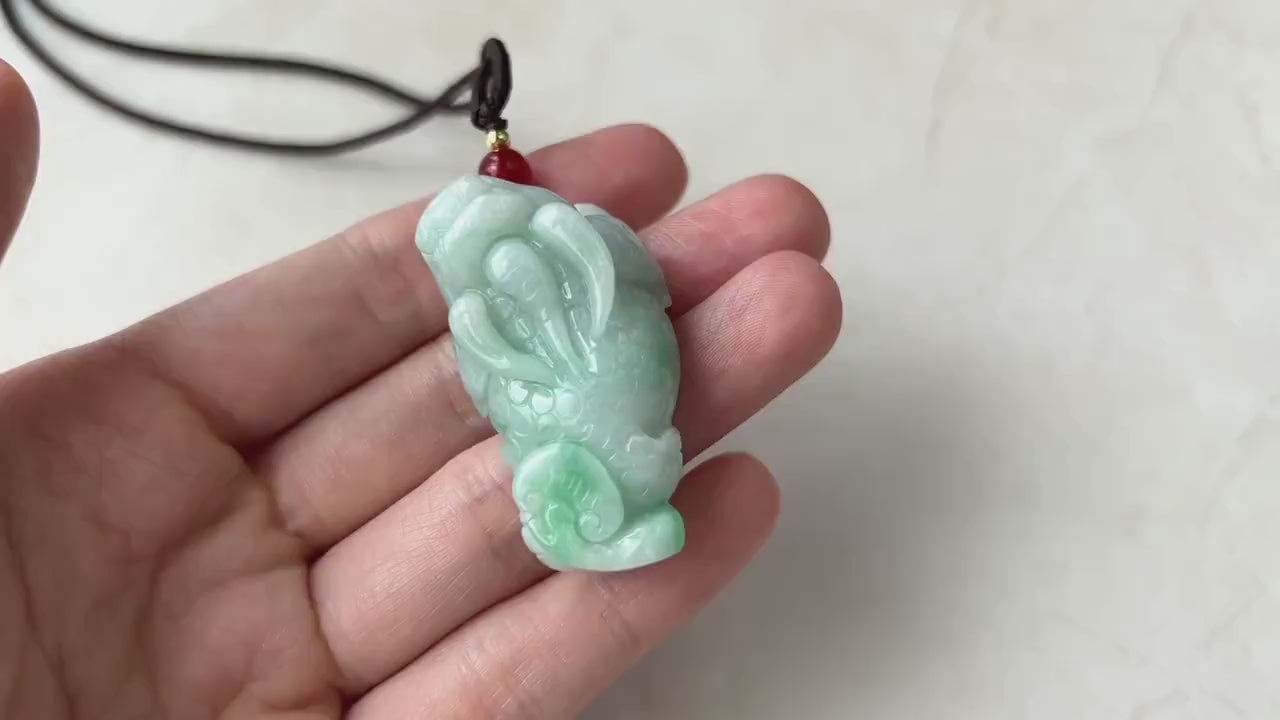 Video of a richly green jadeite Pi Xiu pendant with a glowing translucent carved mythological animal design