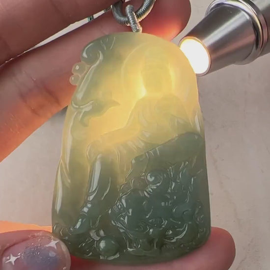Video of hand-carved green jade Guan Yin pendant with protective dragon, intricate detailed carving and decorative reverse si
