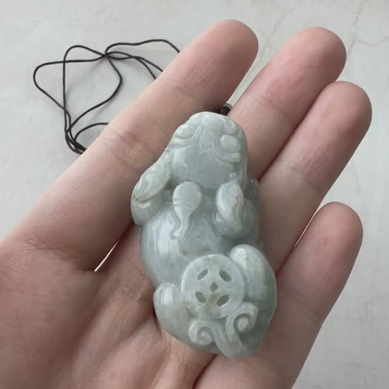 Video of hand-carved jade Pi Xiu with intricate detailing, bold expression, and a majestic traditional style