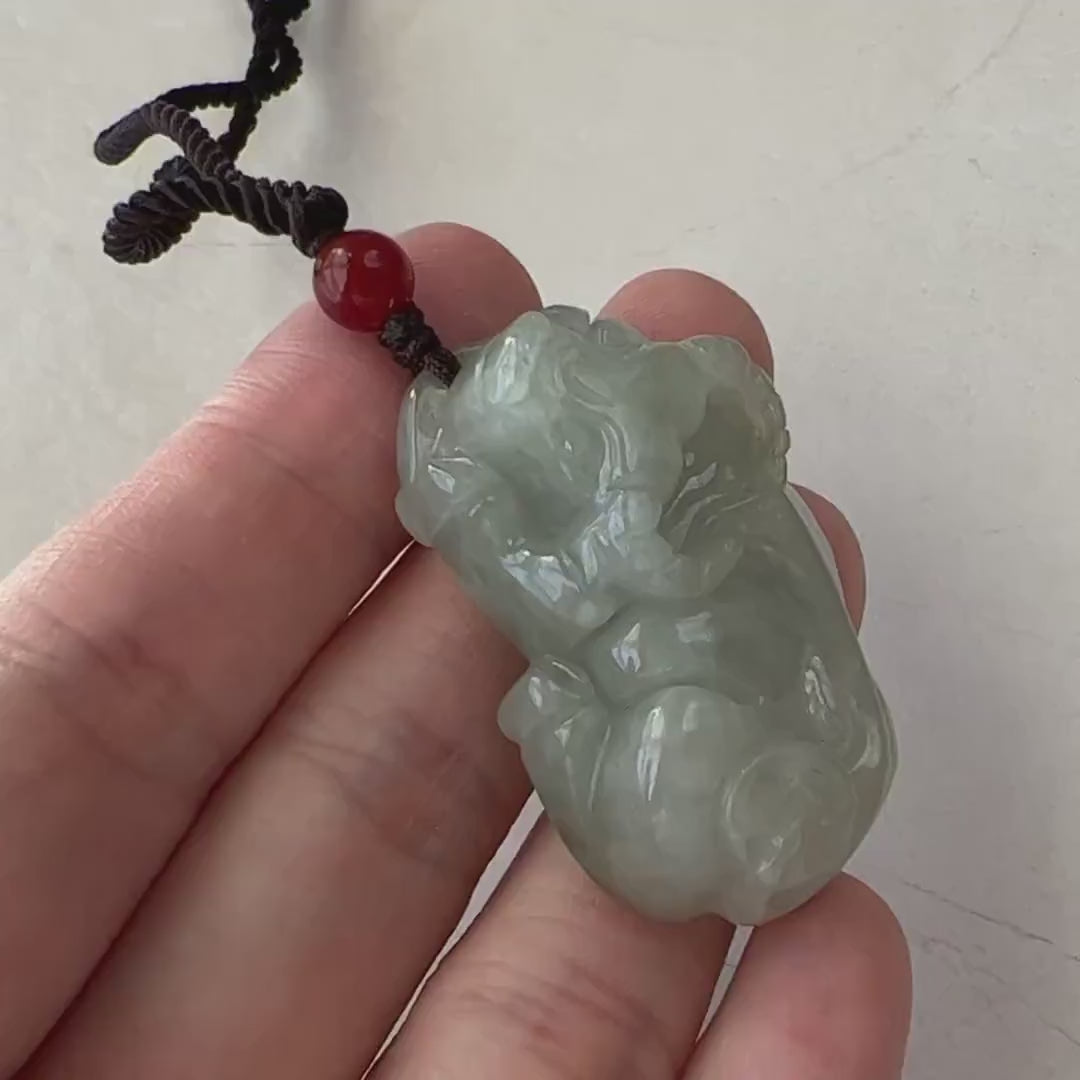 Video of a carved Chinese Zodiac Ox pendant, showcasing a strong, detailed animal design in fine jewelry style