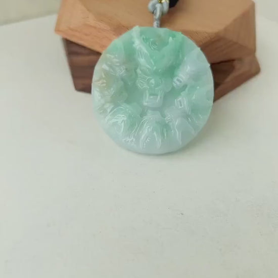 Video of hand-carved green jade jewelry with nine intricate dragon carvings in a majestic, detailed style