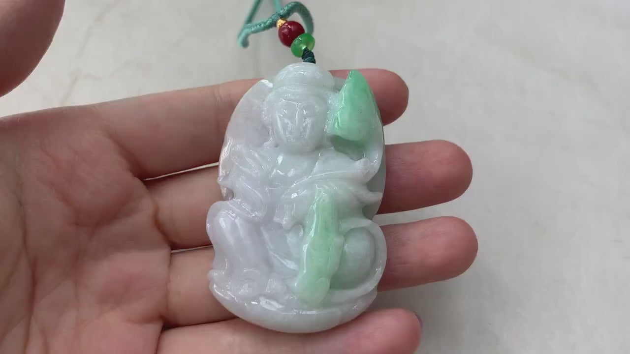 Video of a hand-carved natural jade Guan Yin pendant with a substantial thick profile and intricate details