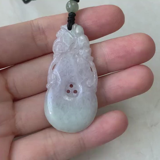 Video of a hand-carved light lavender jadeite calabash hulu pendant with delicate traditional gourd details