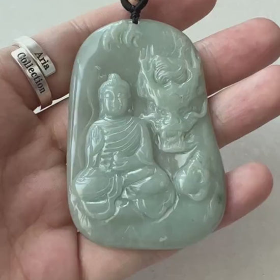 Video of light green semi-translucent jadeite pendant with carved Amitabha Buddha, dragon, and leaf details